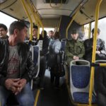 
              Russian recruits sit inside a bus near a military recruitment center in Volgograd, Russia, Saturday, Sept. 24, 2022. Russian President Vladimir Putin on Wednesday ordered a partial mobilization of reservists to beef up his forces in Ukraine. (AP Photo)
            