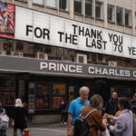 
              People walks past Prince Charles Cinema, which displays a message reading 'Thank you for the last 70 years', in Soho, in London, Tuesday, Sept. 13, 2022. Queen Elizabeth II, Britain's longest reigning monarch, will lie in state at Westminster Palace from Wednesday.(AP Photo/Alberto Pezzali)
            