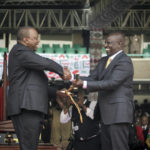 
              Kenya's new president William Ruto, right, shakes hands with outgoing President Uhuru Kenyatta, left, as he is sworn in to office at a ceremony held at Kasarani stadium in Nairobi, Kenya Tuesday, Sept. 13, 2022. Ruto was sworn in as Kenya's president on Tuesday after narrowly winning the Aug. 9 election and after the Supreme Court last week rejected a challenge to the official results by losing candidate Raila Odinga. (AP Photo/Brian Inganga)
            