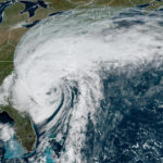 
              This GOES-16 satellite image taken at 1:01 p.m. EDT and provided by NOAA shows Hurricane Ian over the South Carolina coast, Friday, Sept. 30, 2022. (NOAA via AP)
            