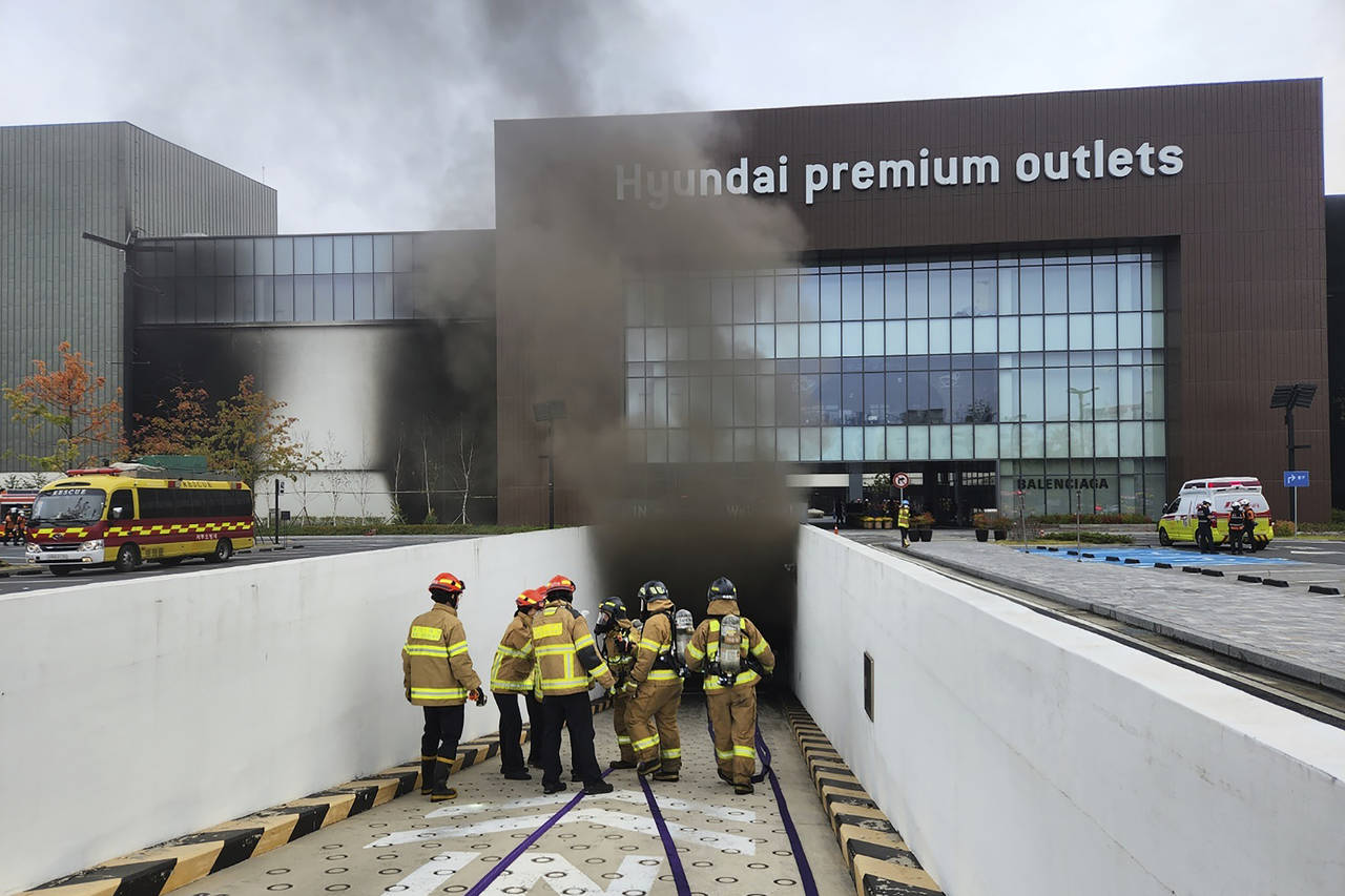 South Korean firefighters work at a shopping mall in Daejeon, South Korea, Monday, Sept. 26, 2022. ...