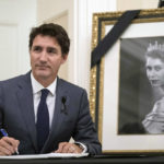 
              Prime Minister Justin Trudeau looks up after signing a book of condolences for Queen Elizabeth II,  at Rideau Hall in Ottawa, Ontario on Friday, Sept. 9, 2022. (Justin Tang/The Canadian Press via AP)
            
