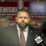
              Ohio Republican congressional candidate J.R. Majewski defends his military record at a news conference Friday, Sept. 23, 2022, in Holland, Ohio. Majewski has campaigned  by presenting himself as an Air Force combat veteran who deployed to Afghanistan after the 9/11 terrorist attacks. Military documents obtained by The Associated Press through a public records request, indicate Majewski never deployed to Afghanistan but instead completed a six-month stint helping to load planes at an air base in Qatar, a longtime U.S. ally that is a safe distance from the fighting. (Phillip L. Kaplan/The Blade via AP)
            
