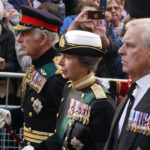 
              King Charles III, Princess Anne and Prince Andrew join the procession of Queen Elizabeth II's coffin from the Palace of Holyroodhouse to St Giles' Cathedral, in Edinburgh, Monday, Sept. 12, 2022. King Charles arrived in Edinburgh on Monday to accompany his late mother’s coffin on an emotion-charged procession through the historic heart of the Scottish capital to the cathedral where it will lie for 24 hours to allow the public to pay their last respects. (Andrew Milligan/Pool Photo via AP)
            