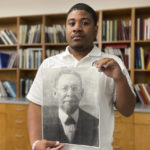 
              Atlanta Board of Education Community Affairs Manager Keith Glass holds an undated photograph of Luther Judson Price on Aug. 25, 2022 in Atlanta. A five-bedroom Victorian house south of Georgia’s capitol was in severe disrepair until an Atlanta couple saw its potential. Then they learned it was built around 1900 by South Atlanta postmaster and civil rights activist Luther Judson Price. The PBS home improvement show “This Old House” will stream episodes on their renovation in September. (AP Photo/Michael Warren)
            