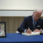 
              President Joe Biden signs a condolence book at the British Embassy in Washington, Thursday, Sept. 8, 2022, for Queen Elizabeth II, Britain's longest-reigning monarch and a rock of stability across much of a turbulent century, who died Thursday after 70 years on the throne. She was 96. (AP Photo/Susan Walsh)
            