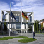 
              The flags in front of the Federal Chancellery are flown at half-mast in honor of the British Queen Elizabeth II, who died yesterday at the age of 96, in Berlin, Friday Sept. 9, 2022. (Bernd von Jutrczenka/dpa via AP)
            