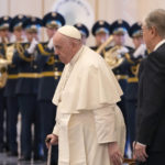 
              Pope Francis arrives with Kazakhstan's President Kassym-Jomart Tokayev for the welcome ceremony at the Presidential Palace Ak Orda, in Nur-Sultan, Kazakhstan, Tuesday, Sept. 13, 2022. Pope Francis begins a 3-days visit to the majority-Muslim former Soviet republic to minister to its tiny Catholic community and participate in a Kazakh-sponsored conference of world religious leaders. (AP Photo/Andrew Medichini)
            