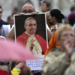 
              A man holds a photo of Pope John Paul I during the beatification ceremony led by Pope Francis in St. Peter's Square at the Vatican. (AP Photo/Andrew Medichini)
            