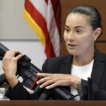 
              Broward Sheriff's Office Sgt. Gloria Crespo testifies about the weapon used by Marjory Stoneman Douglas High School shooter Nikolas Cruz in the 2018 shootings. This during the penalty phase of Cruz's trial at the Broward County Courthouse in Fort Lauderdale, Fla. on Tuesday, Sept. 27, 2022. Sgt. Crespo took the photograph (for evidence purposes) of the gun used by Cruz after the shootings. Cruz previously plead guilty to all 17 counts of premeditated murder and 17 counts of attempted murder in the 2018 shootings. (Amy Beth Bennett/South Florida Sun Sentinel via AP, Pool)
            