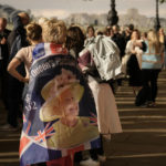
              FILE - People wait in line to pay tribute to Queen Elizabeth II in central London, Sept. 15, 2022. (AP Photo/Vadim Ghirda, File)
            