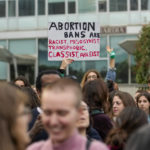 
              People stage a protest on 'International Safe Abortion Day' to ask for more guarantees on the enforcement of the abortion law that they claim is seriously endangered by the high rate of doctors' conscientious objection in the country, in Milan, Wednesday, Sept. 28, 2022. (AP Photo/Luca Bruno)
            