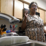 
              A trickle of water comes out of the faucet of Mary Gaines a resident of the Golden Keys Senior Living apartments in her kitchen in Jackson, Miss., Thursday, Sept. 1, 2022. A recent flood worsened Jackson's longstanding water system problems. (AP Photo/Steve Helber)
            