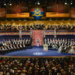 
              FILE - The ten 2016 Nobel laureates in literature, medicine, chemistry, physics and economics are seated, front row left, across from King Carl XVI Gustaf of Sweden and the royal family during the 2016 Nobel prize award ceremony at the Stockholm Concert Hall on Saturday Dec. 10, 2016. This year’s Nobel season approaches as Russia’s invasion of Ukraine has shattered decades of almost uninterrupted peace in Europe and raised the risks of a nuclear disaster. The famously secretive Nobel Committee never leaks or hints who will win its prizes for medicine, physics, chemistry, literature, economics or peace. So it is anyone’s guess who might win the awards that will be announced starting next Monday, Oct. 3, 2022. (Jessica Gow/TT News Agency via AP, File)/TT News Agency via AP)
            