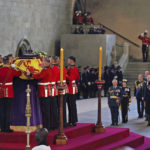 
              The coffin of Queen Elizabeth II is placed in Westminster Hall at the Palace of Westminster for the lying in state, in London, Wednesday, Sept. 14, 2022. (Dan Kitwood/Pool via AP)
            