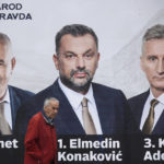 
              A man passes by an election poster of the candidates of the People and Justice Party (NiP) in Sarajevo, Bosnia, Tuesday, Sept. 27, 2022. Bosnia's upcoming general election could be about the fight against corruption and helping its ailing economy. But at the time when Russia has a strong incentive to reignite conflict in the small Balkan nation, the Oct 2. vote appears set to be an easy test for long-entrenched nationalists who have enriched cronies and ignored the needs of the people. (AP Photo/Armin Durgut)
            