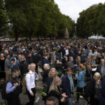 
              People queue to pay their respect to the late Queen Elizabeth II during the Lying-in State, outside Westminster Hall in London, Thursday, Sept. 15, 2022. The Queen will lie in state in Westminster Hall for four full days before her funeral on Monday Sept. 19. (AP Photo/Emilio Morenatti)
            