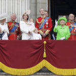 
              FILE - Britain's Queen Elizabeth II , foreground, fourth right, waves as she watches the flypast, with Prince Philip,  third right, Prince William, centre, his son Prince George, front, Kate, the Duchess of Cambridge holding Princess Charlotte, centre left, Prince Charles, third left, Camilla, the Duchess of Cornwall, second left, and Princess Anne on the balcony during the Trooping The Colour parade at Buckingham Palace, in London, June 11, 2016. Queen Elizabeth II, Britain’s longest-reigning monarch and a rock of stability across much of a turbulent century, has died. She was 96. Buckingham Palace made the announcement in a statement on Thursday Sept. 8, 2022. (AP Photo/Tim Ireland, File)
            