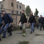 
              FILE Russian recruits walk past a military recruitment center in Volgograd, Russia, Saturday, Sept. 24, 2022. Russian President Vladimir Putin on Wednesday ordered a partial mobilization of reservists to beef up his forces in Ukraine. (AP Photo, File)
            