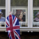 
              A man looks at framed portraits of Queen Elizabeth II in a shop window near Windsor Castle in Windsor, England, Friday, Sept. 9, 2022. Queen Elizabeth II, Britain's longest-reigning monarch and a rock of stability across much of a turbulent century, died Thursday after 70 years on the throne. She was 96. (AP Photo/Frank Augstein)
            