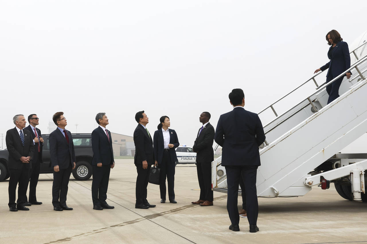 U.S. Vice President Kamala Harris, right, exits Air Force Two at Osan Air Base on her arrival, in P...