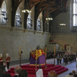 
              The coffin of Queen Elizabeth II rests in Westminster Hall at the Palace of Westminster in London, Wednesday, Sept. 14, 2022. (Dan Kitwood/Pool via AP)
            