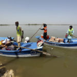 
              Victims of the unprecedented flooding from monsoon rains receive relief aid, organized by the Islamic group Jamaat-e-Islami Pakistan, in Sukkur, Pakistan, Sunday, Sept. 4, 2022. Officials warned Sunday that more flooding was expected as Lake Manchar in southern Pakistan swelled from monsoon rains that began in mid-June and have killed nearly 1,300 people. (AP Photo/Fareed Khan)
            
