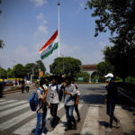 
              The Indian flag flies at half-mast at the Central Park in Connaught Place following Thursday’s death of Britain's Queen Elizabeth II in New Delhi, India, Sunday, Sept.11, 2022. (AP Photo/Manish Swarup)
            
