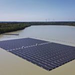 
              File - Solar panels on Germany's biggest floating photovoltaic plant produce energy under a blue sky on a lake in Haltern, Germany, Tuesday, May 3, 2022. Long periods of sunshine took solar power generation in Europe to a record high this summer, helping reduce the need for gas imports, according to a report Thursday. Energy think tank Ember said the European Union generated 12% of its electricity from solar power from May to August, up from 9% during the same period last year. (AP Photo/Martin Meissner, File )
            