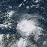 
              This satellite image provided by NOAA shows Tropical Storm Fiona in the Caribbean on Saturday, Sept. 17, 2022. 
 Fiona threatened to dump up to 16 inches (41 centimeters) of rain in parts of Puerto Rico on Saturday as forecasters placed the U.S. territory under a hurricane watch and people braced for potential landslides, severe flooding and power outages. (NOAA via AP)
            