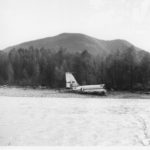 A Boeing 707 that crashed near Oso, Washington on October 19, 1959 was about to be delivered to Braniff Airlines.  In this photograph taken by Ron Palmer, a man can be seen painting over the Braniff logo on the jetliner’s vertical stabilizer. (Courtesy Ron Palmer) 

 