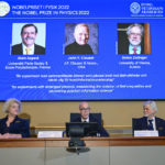 
              Secretary General of the Royal Swedish Academy of Sciences Hans Ellegren, centre, Eva Olsson, left and Thors Hans Hansson, members of the Nobel Committee for Physics announce the winner of the 2022 Nobel Prize in Physics, from left to right on the screen, Alain Aspect, John F. Clauser and Anton Zeilinger, during a press conference at the Royal Swedish Academy of Sciences, in Stockholm, Sweden, Tuesday, Oct. 4, 2022. (Jonas Ekstromer /TT News Agency via AP)
            