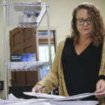 
              Wayne County Elections Director Anne Risku prepares absentee ballots at the Wayne County Board of Elections office on Thursday, Sept. 22, 2022, in Goldsboro, N.C. (AP Photo/Hannah Schoenbaum)
            