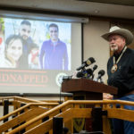 
              Merced County Sheriff Vern Warnke speaks at a news conference about the kidnapping of 8-month-old Aroohi Dheri, her mother Jasleen Kaur, her father Jasdeep Singh, and her uncle Amandeep Singh, in Merced, Calif., on Wednesday, Oct. 5, 2022. Relatives of the family kidnapped at gunpoint from their trucking business in central California pleaded for help Wednesday in the search for an 8-month-old girl, her mother, father and uncle, who authorities say were taken by a convicted robber who tried to kill himself a day after the kidnappings. (Andrew Kuhn/The Merced Sun-Star via AP)
            