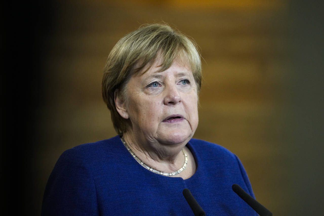 FILE - At this time German Chancellor Angela Merkel talks to the media during her visit at the TUMO...