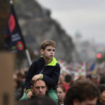 
              People gather to demonstrate in solidarity with students and teachers demanding higher wages and better working conditions, at Liberty Bridge, in Budapest, Hungary, Sunday, Oct. 23, 2022, on the national holiday of the 66th anniversary of the Hungarian anti-communist uprising of 1956.
            