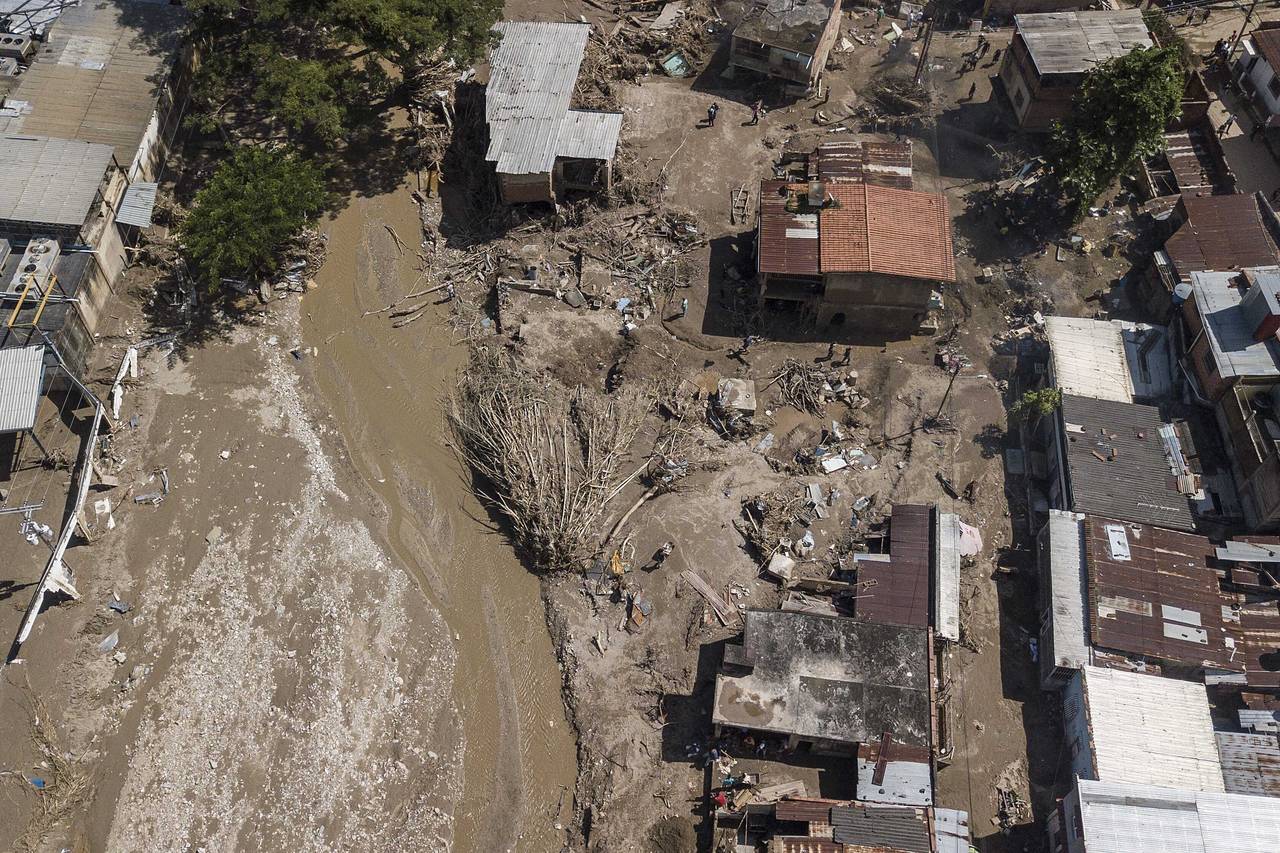 View of Las Tejerias after a landslide and flood ripped through the town in Venezuela, Monday, Oct....