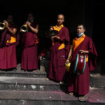
              Buddhist monks play traditional instruments as they performs rituals during the funeral of famed American extreme skier Hilaree Nelson in Kathmandu, Nepal, Sunday, Oct.2, 2022. Nelson had died last week on Mount Manaslu while coming down from the top of the summit the 8,163-meter (26,775-foot) world's eighth-highest mountain. (AP Photo/Niranjan Shrestha)
            
