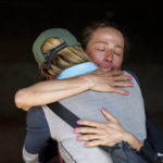 
              Friends and family members mourn during the funeral of famed American extreme skier Hilaree Nelson in Kathmandu, Nepal, Sunday, Oct.2, 2022. Nelson had died last week on Mount Manaslu while coming down from the top of the summit the 8,163-meter (26,775-foot) world's eighth-highest mountain. (AP Photo/Niranjan Shrestha)
            