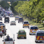 
              Following autopsies at the Udon Thani Hospital in Udon Thani, a line of ambulances carry the bodies of the victims in the Thursday day care attack back to their families waiting in neighboring Uthai Sawan, north eastern Thailand, Friday, Oct. 7, 2022. (AP Photo/Wason Wanichakorn)
            