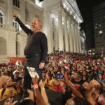 
              FILE - Brazil's former President Luiz Inacio Lula da Silva stands amid supporters during the final rally of his week-long campaign tour of southern Brazil, in Curitiba, Parana state, Brazil, March 28, 2018. (AP Photo/Eraldo Peres, File)
            