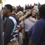 
              People gather outside after a shooting at Central Visual and Performing Arts high school in St. Louis, on Monday, Oct. 24, 2022. (Jordan Opp/St. Louis Post-Dispatch via AP)
            
