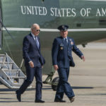 
              President Joe Biden escorted by Col. Matthew Jones, Commander of the 89th Airlift Wing walks from Marine One to board Air Force One at Andrews Air Force Base, Md., Friday, Oct. 7, 2022. Biden is traveling to Hagerstown, Md., to visit the Volvo Group Powertrain Operations. (AP Photo/Gemunu Amarasinghe)
            
