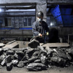 
              In this photo released by Xinhua News Agency, a worker sort coals at Qianyingzi coal mine in Suzhou, east China's Anhui Province, Oct. 20, 2021. China plans to boost coal production through 2025 to avoid a repeat of last year's power shortages, an official said Monday, Oct. 17, 2022. adding to setbacks in efforts to cut climate-changing carbon emissions from the biggest global source. (Han Xu/Xinhua via AP)
            
