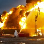 
              Fifighters work at the site of burning tanks after shelling of an oil depot by Ukrainian forces in Shakhtarsk, Donetsk People's Republic, eastern Ukraine, Thursday, Oct. 27, 2022. (AP Photo)
            