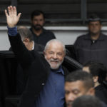 
              Former Brazilian President Luiz Inacio Lula da Silva, who is running for president again, waves upon his arrival to a polling station to vote in the general election in Sao Paulo, Brazil, Sunday, Oct. 2, 2022. (AP Photo/Marcelo Chello)
            