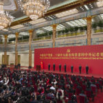 
              New members of the Politburo Standing Committee, from left, Li Xi, Cai Qi, Zhao Leji, President Xi Jinping, Li Qiang, Wang Huning, and Ding Xuexiang are introduced at the Great Hall of the People in Beijing, Sunday, Oct. 23, 2022. (AP Photo/Andy Wong)
            