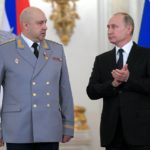 
              FILE - Russian President Vladimir Putin, right, applauds Col. Gen. Sergei Surovikin during an awards ceremony for troops who fought in Syria, in the Kremlin, in Moscow, Russia, Dec. 28, 2017. Surovikin has become the face of Russia’s new strategy in Ukraine, which includes unleashing a barrage of strikes against the country's infrastructure. (Alexei Druzhinin, Sputnik, Kremlin Pool Photo via AP, File)
            
