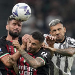 
              AC Milan's Olivier Giroud, left, jump for the header during the Serie A soccer match between AC Milan and Juventus at the San Siro stadium, in Milan, Italy, Saturday, Oct. 8, 2022. (AP Photo/Antonio Calanni)
            
