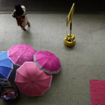 
              Umbrellas lay for sale at a bus station the day after presidential elections lead to a second round in Brasilia, Brazil, Monday, Oct. 3, 2022. The second round is set for Oct. 30. (AP Photo/Eraldo Peres)
            